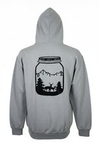 Gray hoodie with a black silhouette design of a jar with a deer and mountains on the back, on a white background.