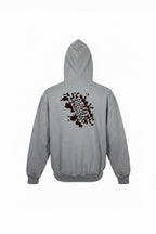 Gray hoodie with a brown abstract design on the back against a white background