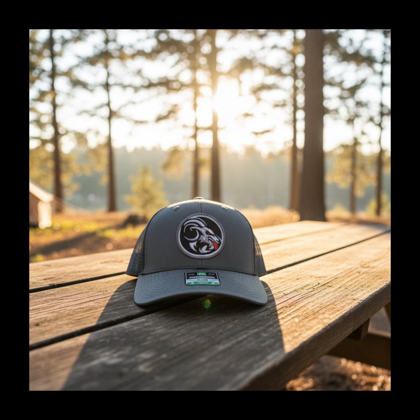 Gray cap with a logo on a wooden table